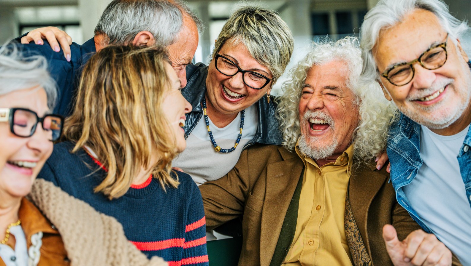 A happy group of senior friends laughing together
