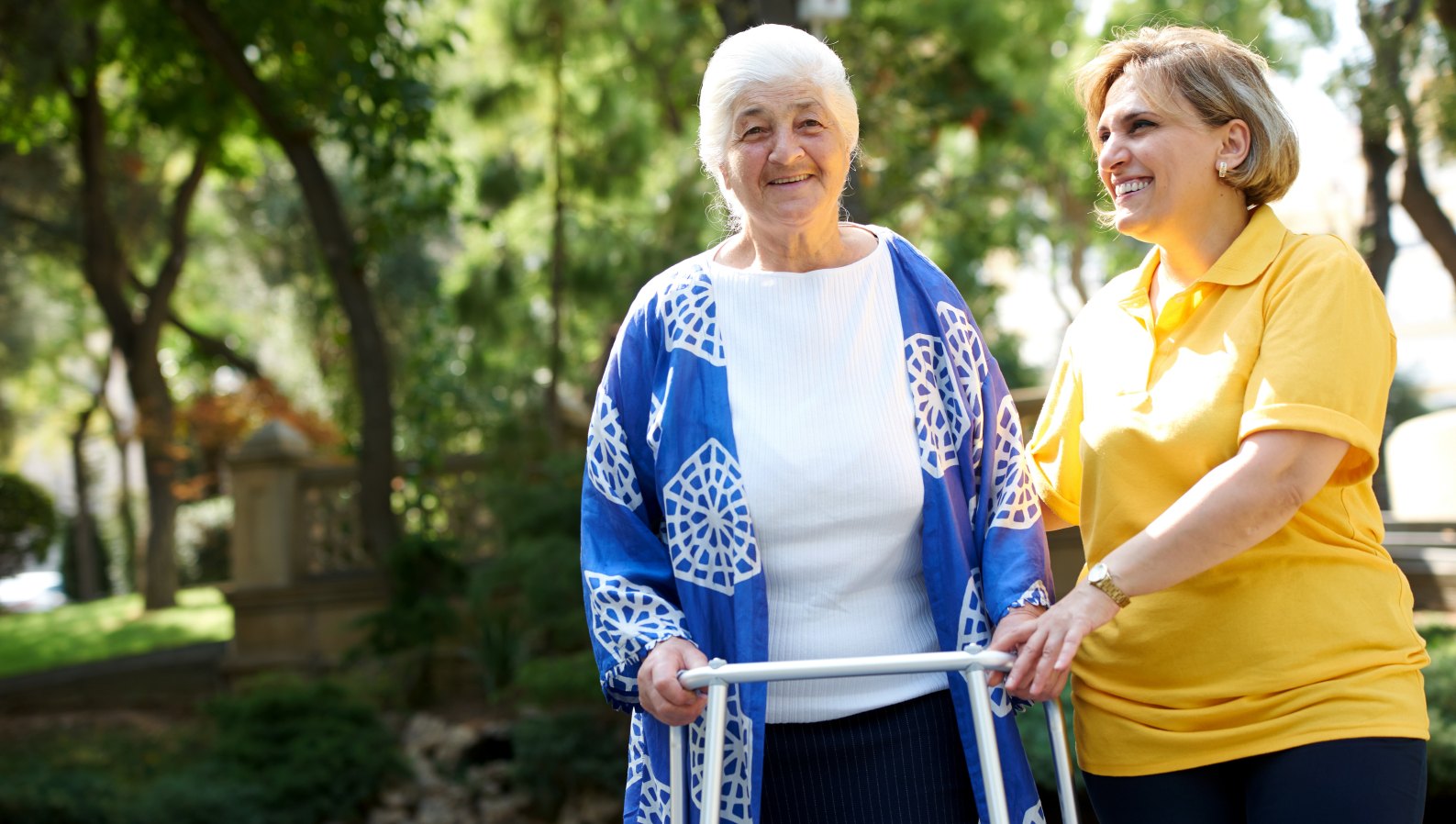 A caring caregiver spending time with a senior during a visit